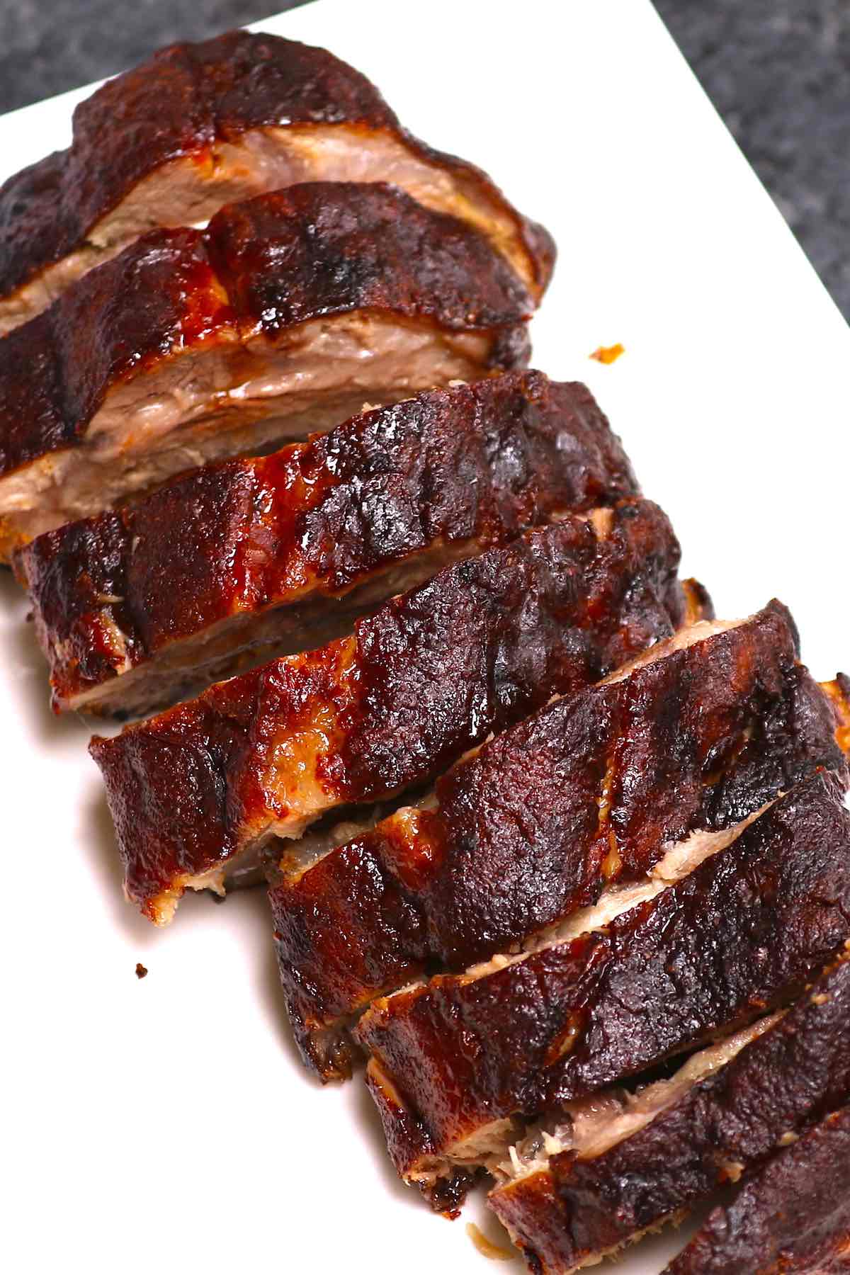 Overhead view of 3 2 1 ribs on a serving platter after having been cut into individual sections