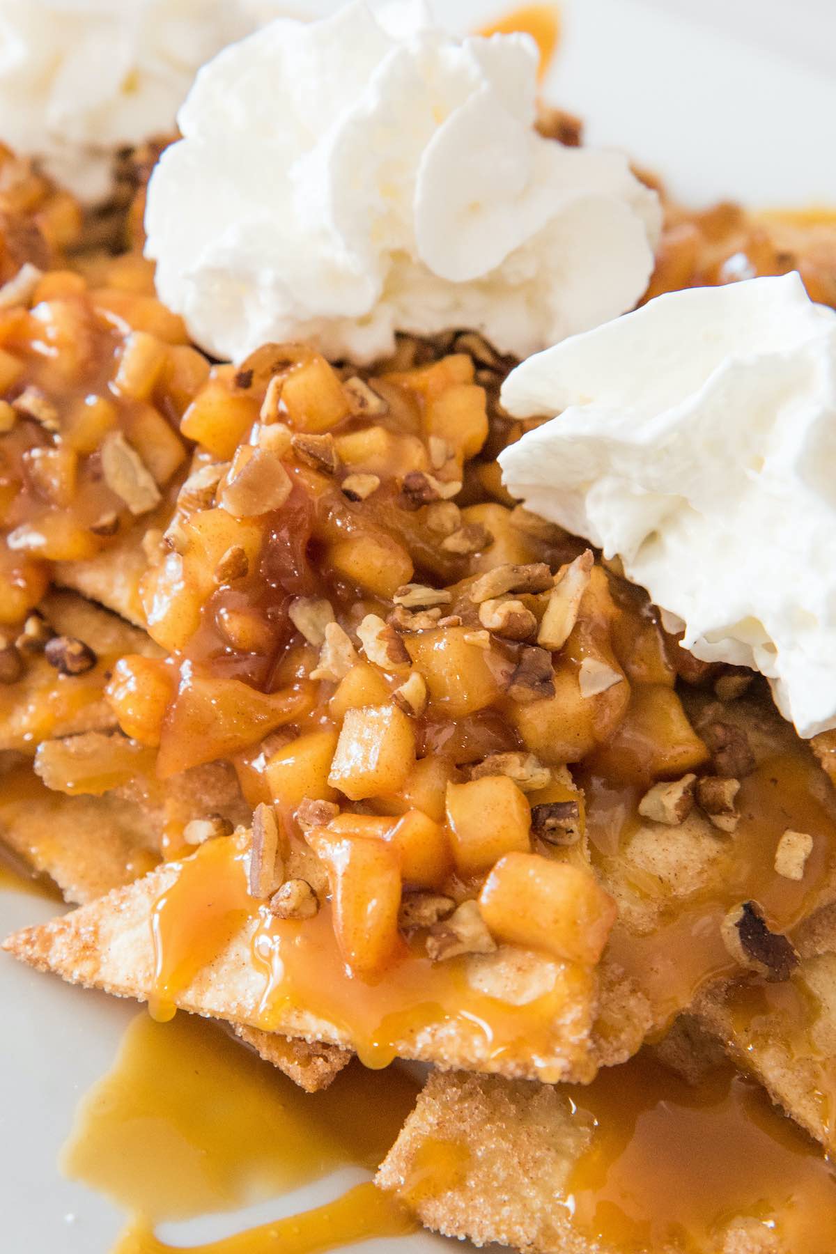 Apple Pie Nachos topped with whipped cream