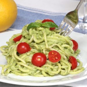 This is a photo of Avocado Pasta on a plate - a delicious, healthy and vegan lunch or dinner idea with a beautiful green color