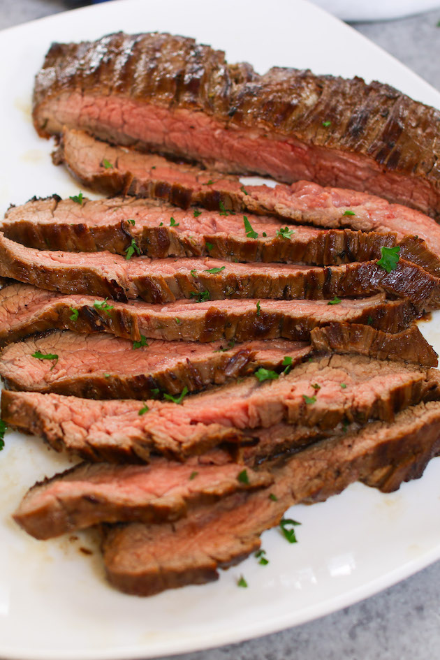 The Best Flank Steak Marinade that makes super juicy and flavorful flank steak every time! This marinade recipe is flavored with soy sauce, honey, lime, and garlic, tenderizing the meat while adding mouth-watering flavors