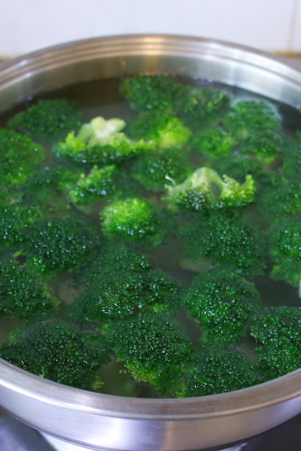 Boil broccoli in a pot