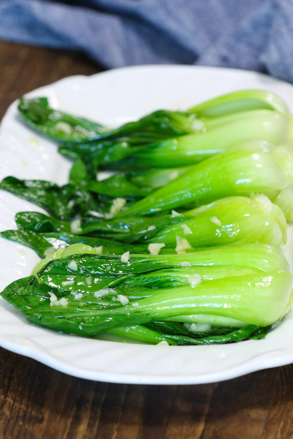 Bok choy is one of my favorite veggies and I have served it as a side dish with chicken, beef, salmon and rice/noodles. The best way to enjoy this leafy green vegetable is to simply stir-fry it and it comes together in less than 10 minutes! 