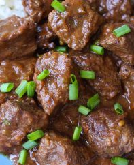 Closeup of Carne Guisada showing its delicious chunks of beef in a rich brown gravy