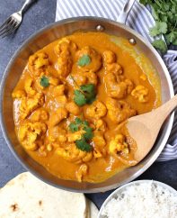 Cauliflower Curry is a rich, creamy and aromatic dish that my whole family loves! This easy coconut curry is loaded with tender cauliflower simmered with authentic spices and is cooked in one pot in under 30 minutes.
