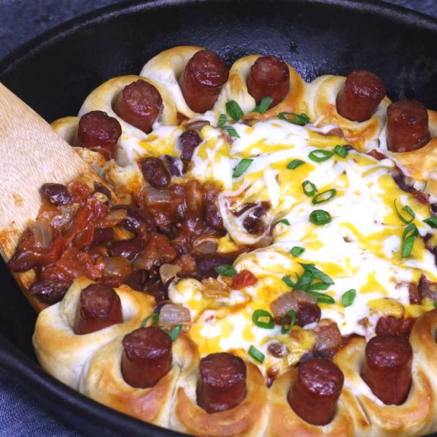 Chili Party Ring - this photo shows bean chili being served with a spatula next to pieces of hot dog baked in biscuit dough - so good!