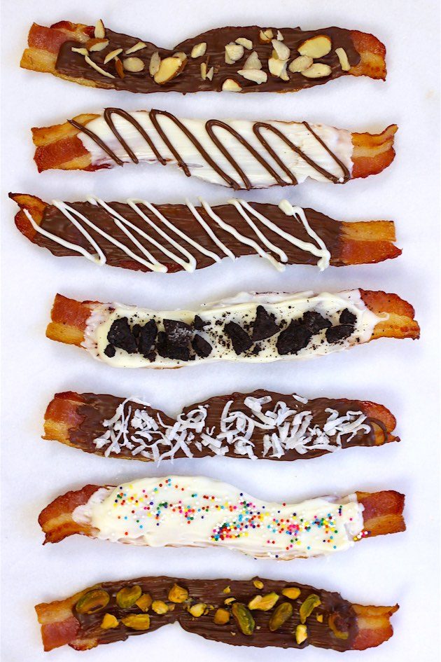 Chocolate covered bacon made six different ways including with dark chocolate, white chocolate, nuts and sprinkles