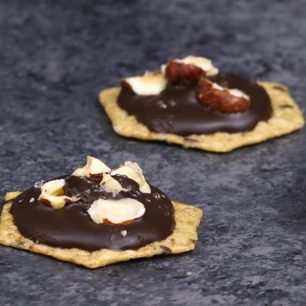 Chocolate hazelnut cluster party appetizers made with melted chocolate, crushed filberts an Crunchmaster crackers