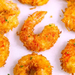These Coconut Shrimp make an irresistible appetizer that's tender on the inside, and crispy, sweet and crunchy on the outside. They're mouthwateringly delicious and will be the first to go at a party! Plus recipe video tutorial!
