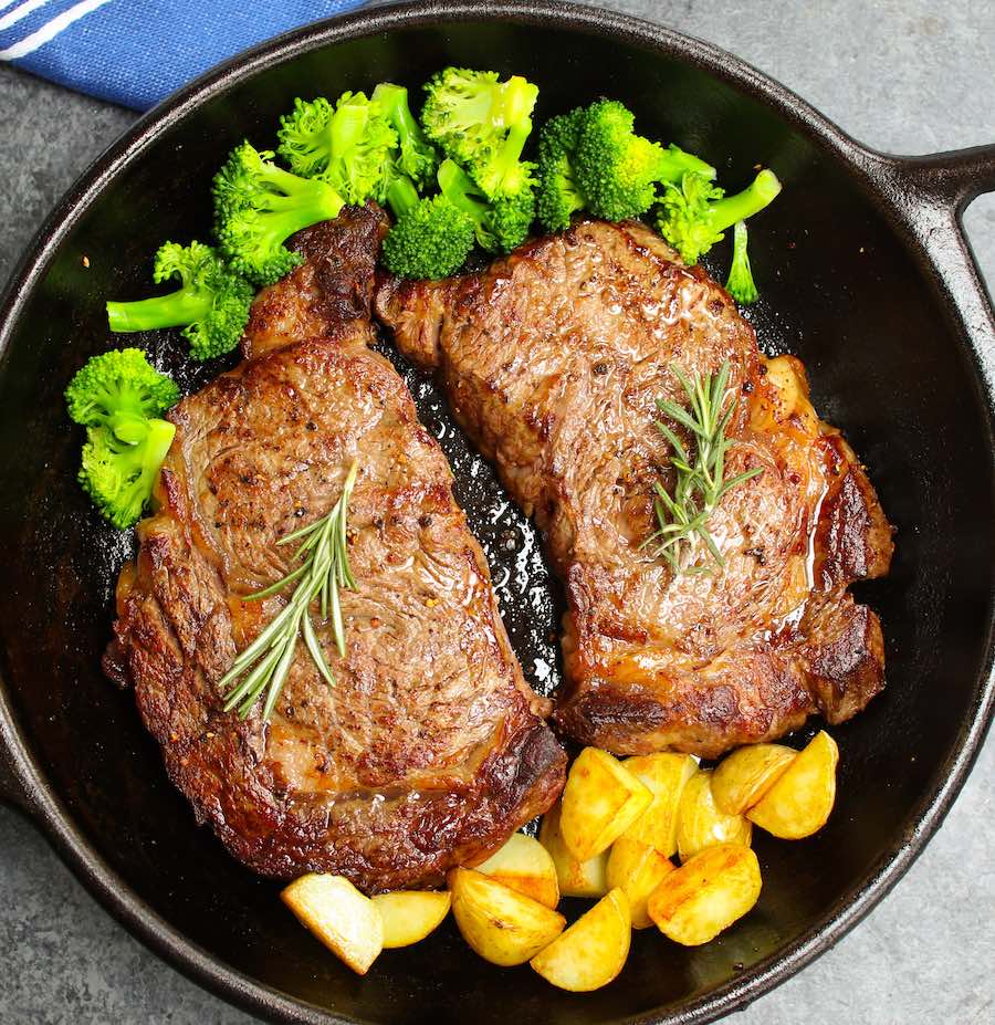 Comparison of cooked bone-in rib and boneless rib eye steak