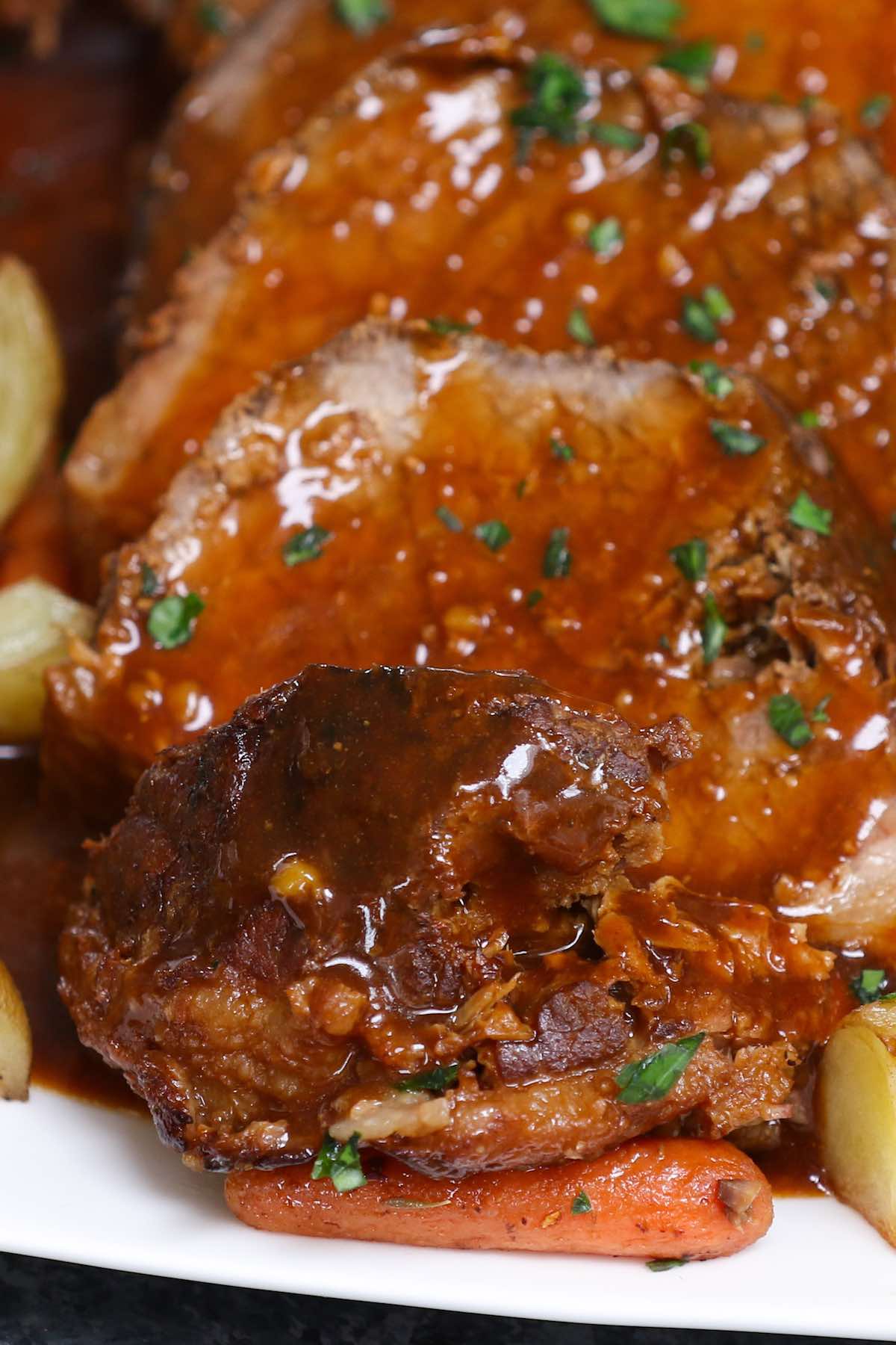 Closeup of roast beef with gravy on top
