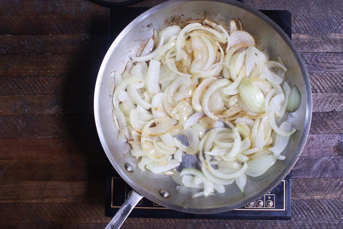 Sautee sliced onions in a pan