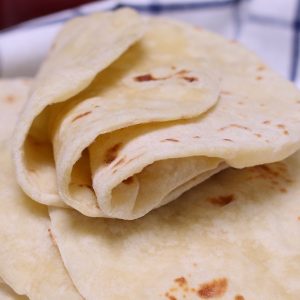 Homemade Flour Tortillas are soft, tender and fluffy – a delicious Mexican thin flatbread made from scratch! It’s easy to make with only 5 simple ingredients, and can be done completely by hand!