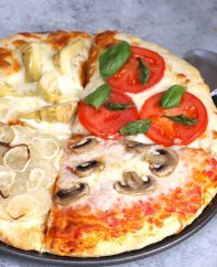 Four Seasons Pizza is divided into sections with different toppings representing the four seasons. This classic Italian recipe starts with homemade pizza dough and fresh ingredients for the best flavor. It’s so much fun to make and eat!