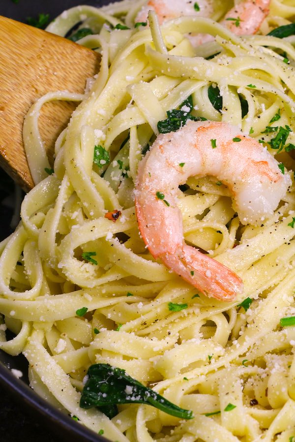 This Garlic Butter Shrimp Pasta is a simple and incredibly delicious one pot meal you can make in under 30 minutes. Tender and juicy shrimp are cooked in a garlicky and buttery sauce before being tossed with baby spinach and freshly grated parmesan. It’s a quick and easy dish that’s restaurant quality.
