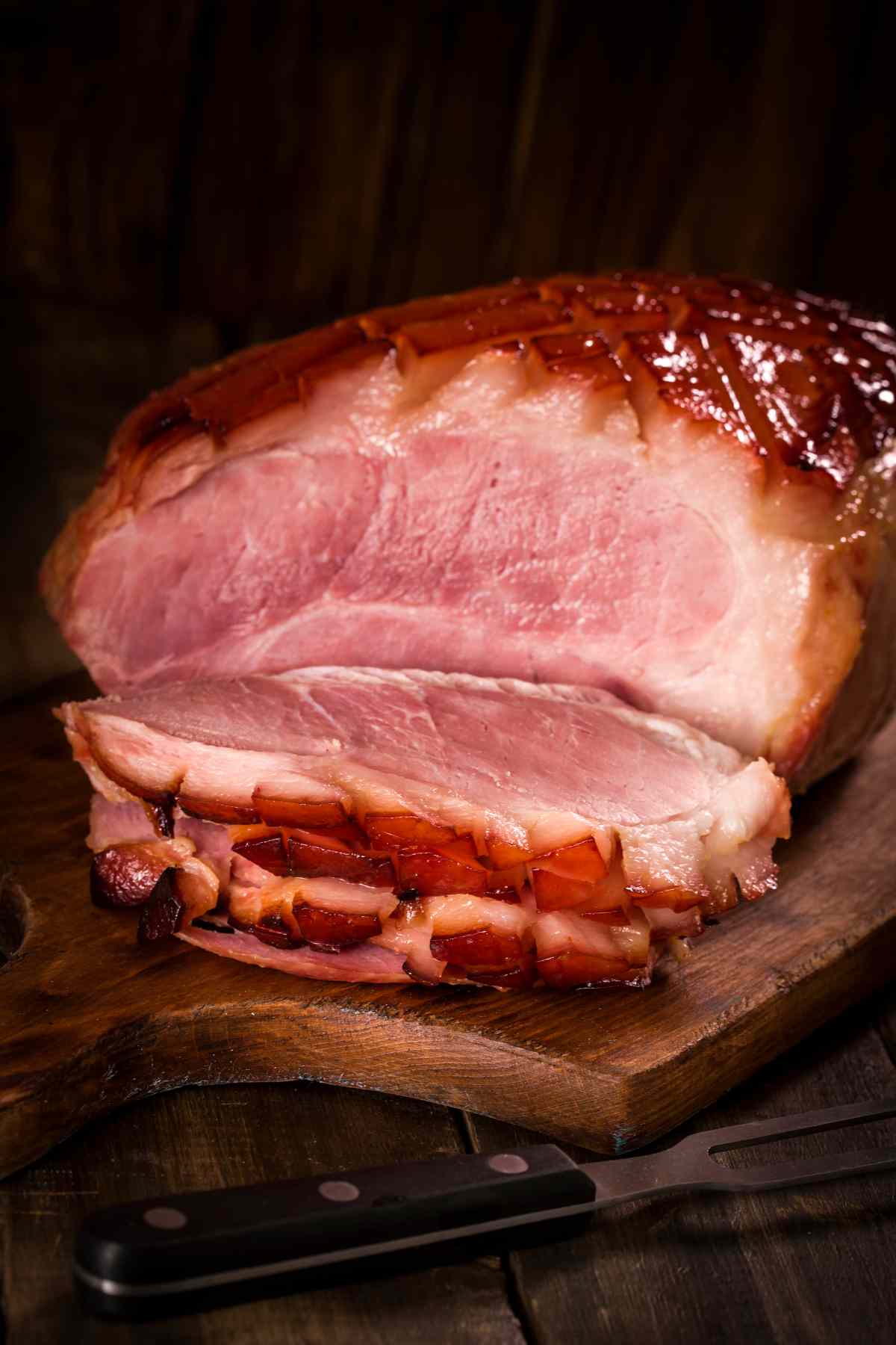 Precooked ham on a carving board