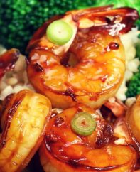 Honey garlic shrimp with a side of broccoli on a bed of steamed rice