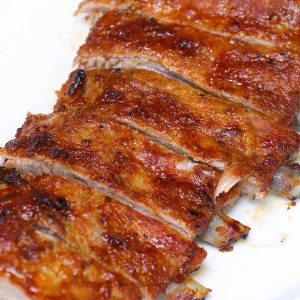 Oven baked back ribs on a serving plate