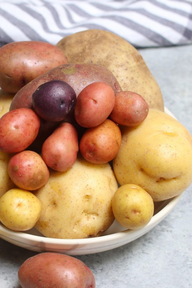 Different types of spuds including red, white, purple and russet