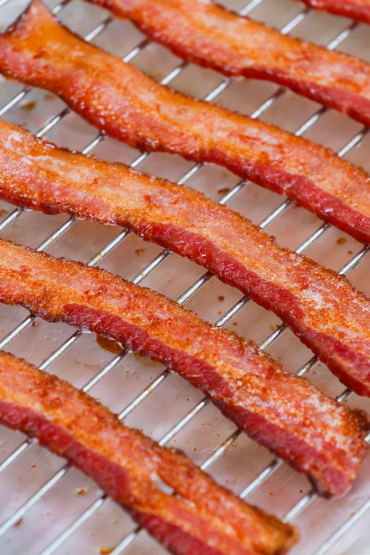 Crispy baked thick-cut bacon on a wire rack.