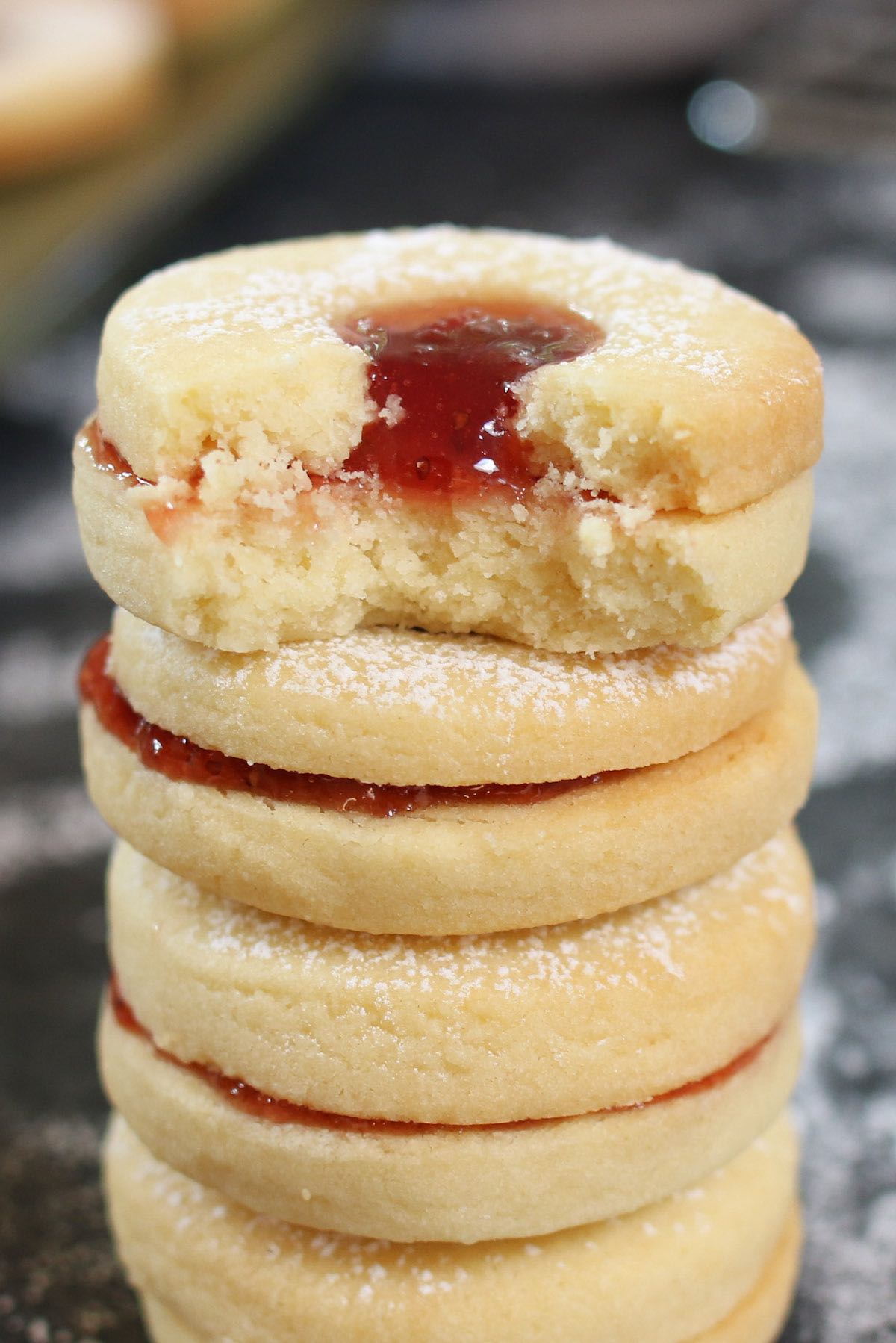 Bite out of a Jammie Dodger cookie, showing the soft and chewy texture.