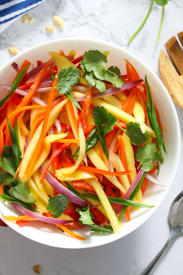 Closeup of Mango Salad served in a white salad bowl makes an attractive side dish