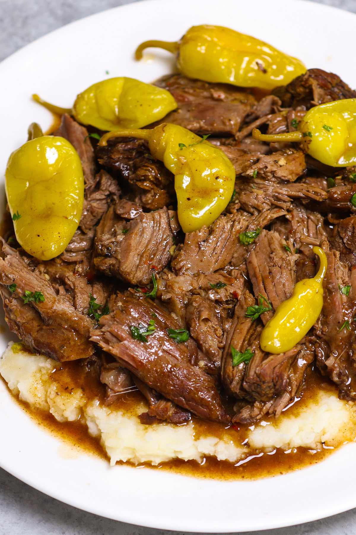 Mississippi Pot Roast is a fork-tender chuck roast that’s full of flavor! This no-fuss “dump and go” pot roast recipe is made with 5 ingredients in a crockpot with only 10 minutes of prep!