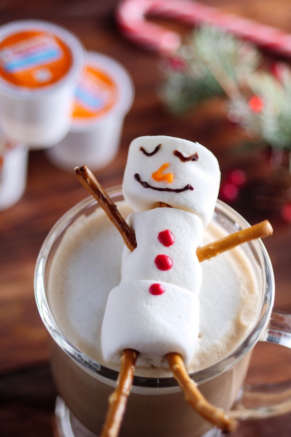 Snowman Mocha Lattes are a festive hot drink to share with family and friends during the holiday season, made with marshmallows, pretzels, cocoa, Dunkin' Donuts coffee and steamed milk