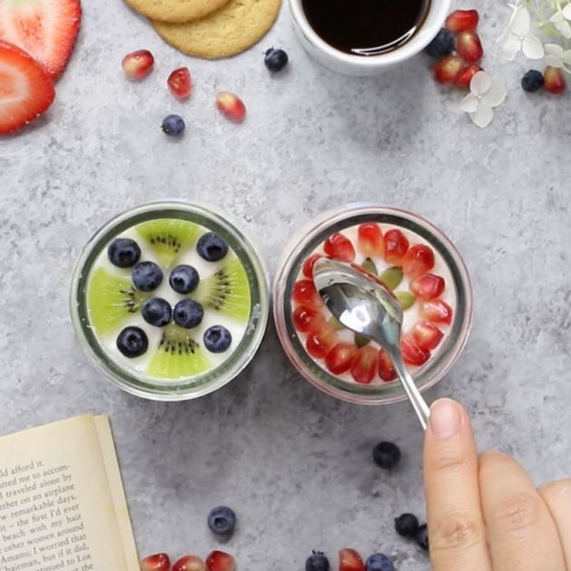 This is a photo of a spoon about to cut into the delicious Oui By Yoplait French-style yogurt and fresh fruits for the perfect break during a busy day