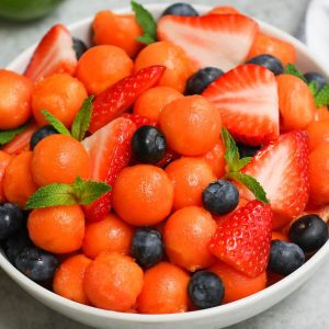 A bowl of fruit salad made with fresh papaya