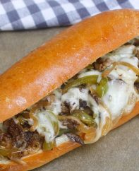 Philly Cheesesteak Recipe is a classic combination of thinly sliced steak and melted cheese in a soft and crusty roll. This philly steak sandwich is easy to make at home and rivals the best philly cheesesteaks in Philadelphia!
