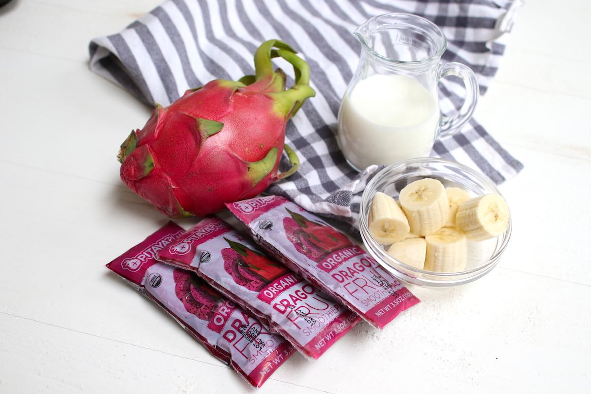 Ingredients for a pitaya bowl: dragon fruit, banana chunks and almond milk