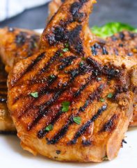 The Best Ever Pork Chop Marinade produces tender and flavorful pork chops every time! It’s an easy pork marinade recipe made with soy sauce, brown sugar, vinegar, garlic, olive oil, and ketchup. You can use the marinated pork chops for grilling, pan frying, or baking.
