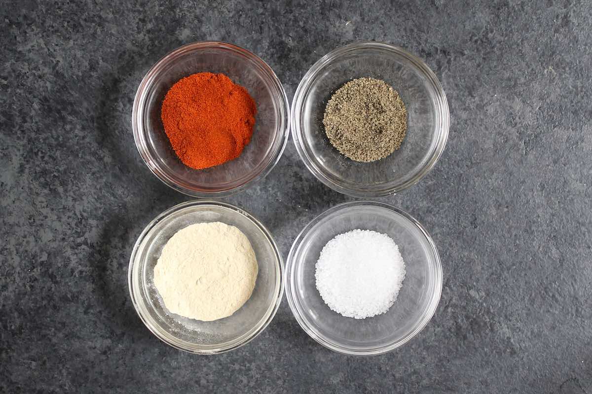 Seasonings for fried pork chops: paprika, garlic powder, salt and pepper