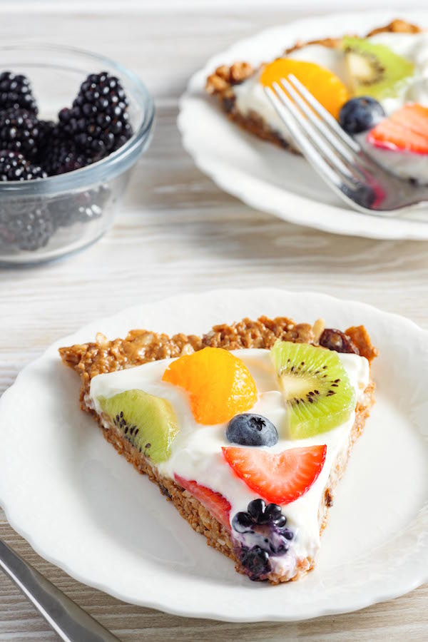 A serving of Raisin Bran Fruit Pizza on a plate as part of a delicious breakfast on the lighter side