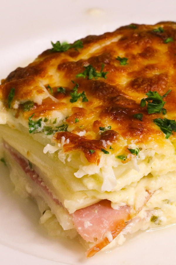 Scalloped Potatoes and Ham served on a white plate