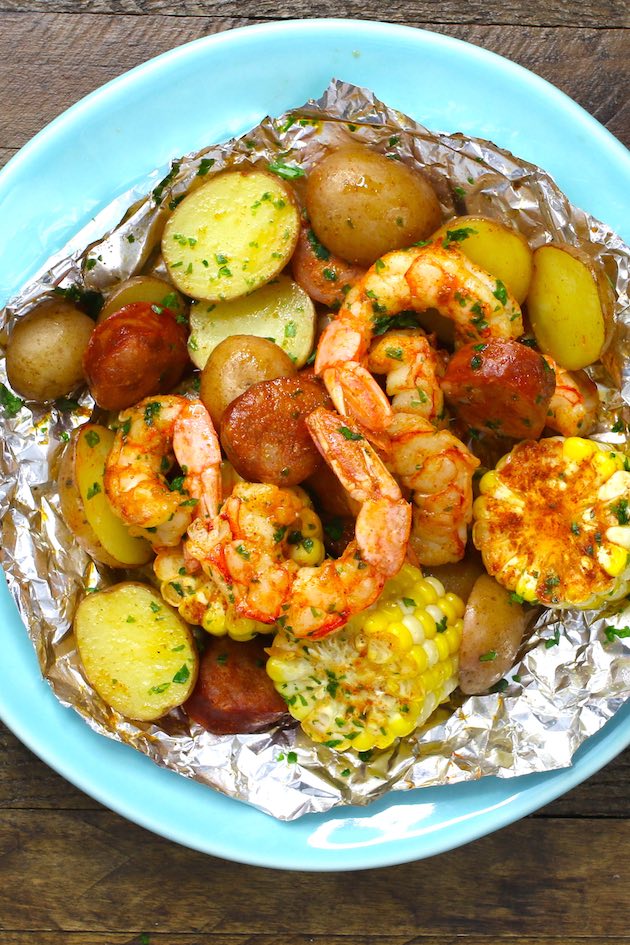Overhead view of a Shrimp Boil Foil Packet opened up and served in a plate for a delicious summertime meal