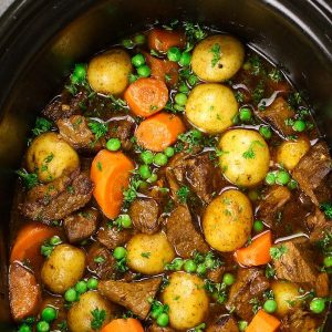 Slow Cooker Beef Stew is one of the best hearty and comfort food to make in a crock pot. Tender and melt-in-your-mouth beef is simmered in a rich and divine sauce with carrots, onions, and potatoes. Your family and friends will ask for this Crock Pot Beef Stew again and again! Plus recipe video tutorial!