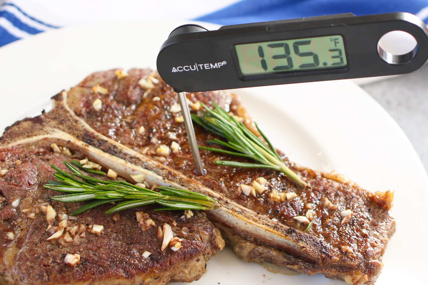 Check steak doneness is by inserting an instant-read thermometer into the middle of the steak