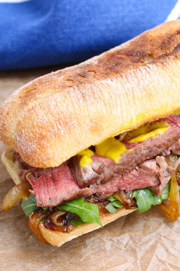 Steak Sandwich is a hearty and flavorful sandwich loaded with tender and thinly-sliced steak, green vegetables, caramelized onions and mustard, along with the delicious toasted buns. It’s perfect for lunch or dinner. 