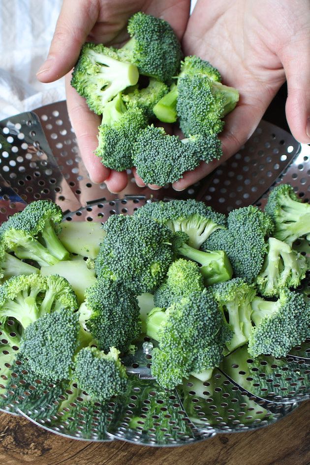 Raw broccoli cut into 2-inch sized pieces, and added to a steam basket