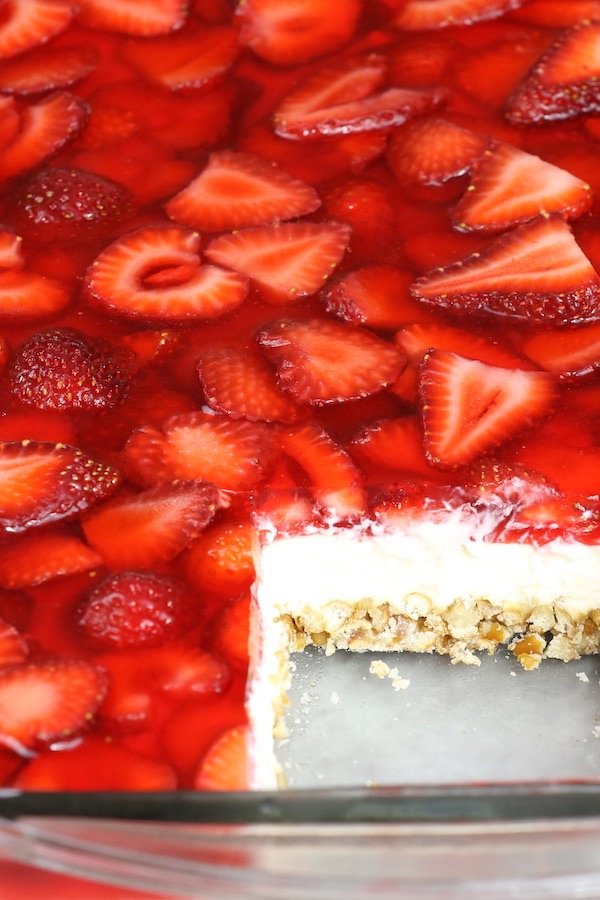 This Strawberry Pretzel Salad has mouthwatering layers of crushed pretzels and cheesecake topped with sliced strawberries in jello. It's the perfect dessert you can make ahead of time for a party or holiday with friends and family.