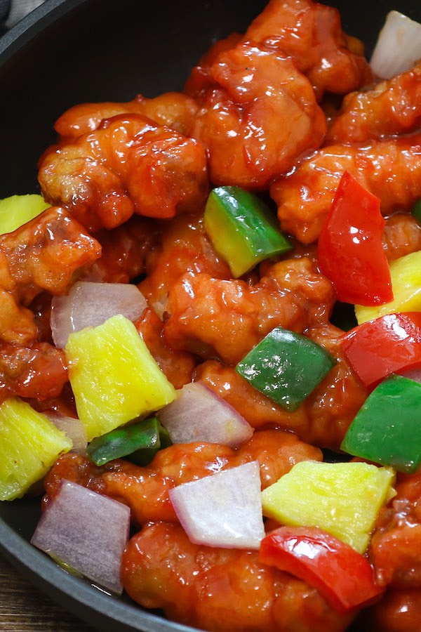 This homemade Sweet and Sour Pork with onions, belle peppers and pineapple is mouthwateringly delicious, better than Chinese takeout