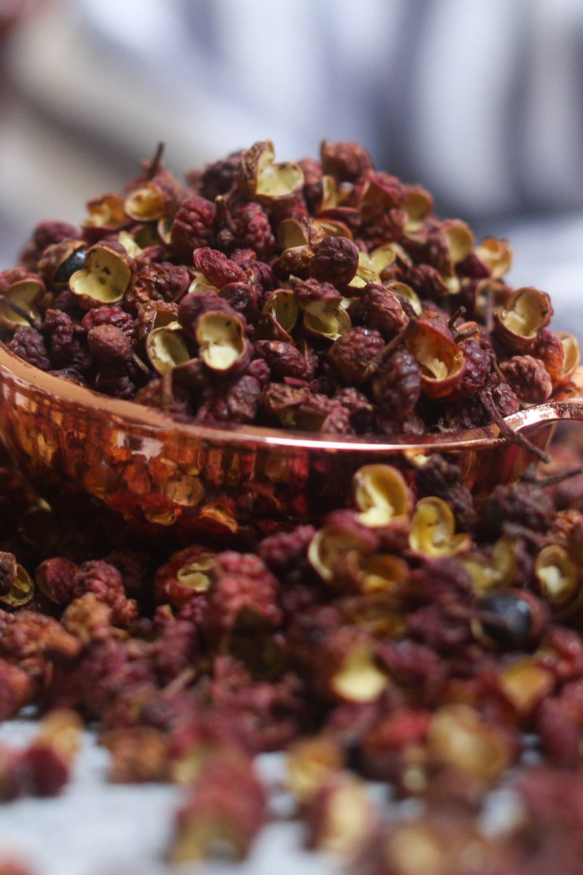 Szechuan peppercorn is a spice produced from the pinkish-red husks of seeds of the prickly ash tree (Zanthoxylum).