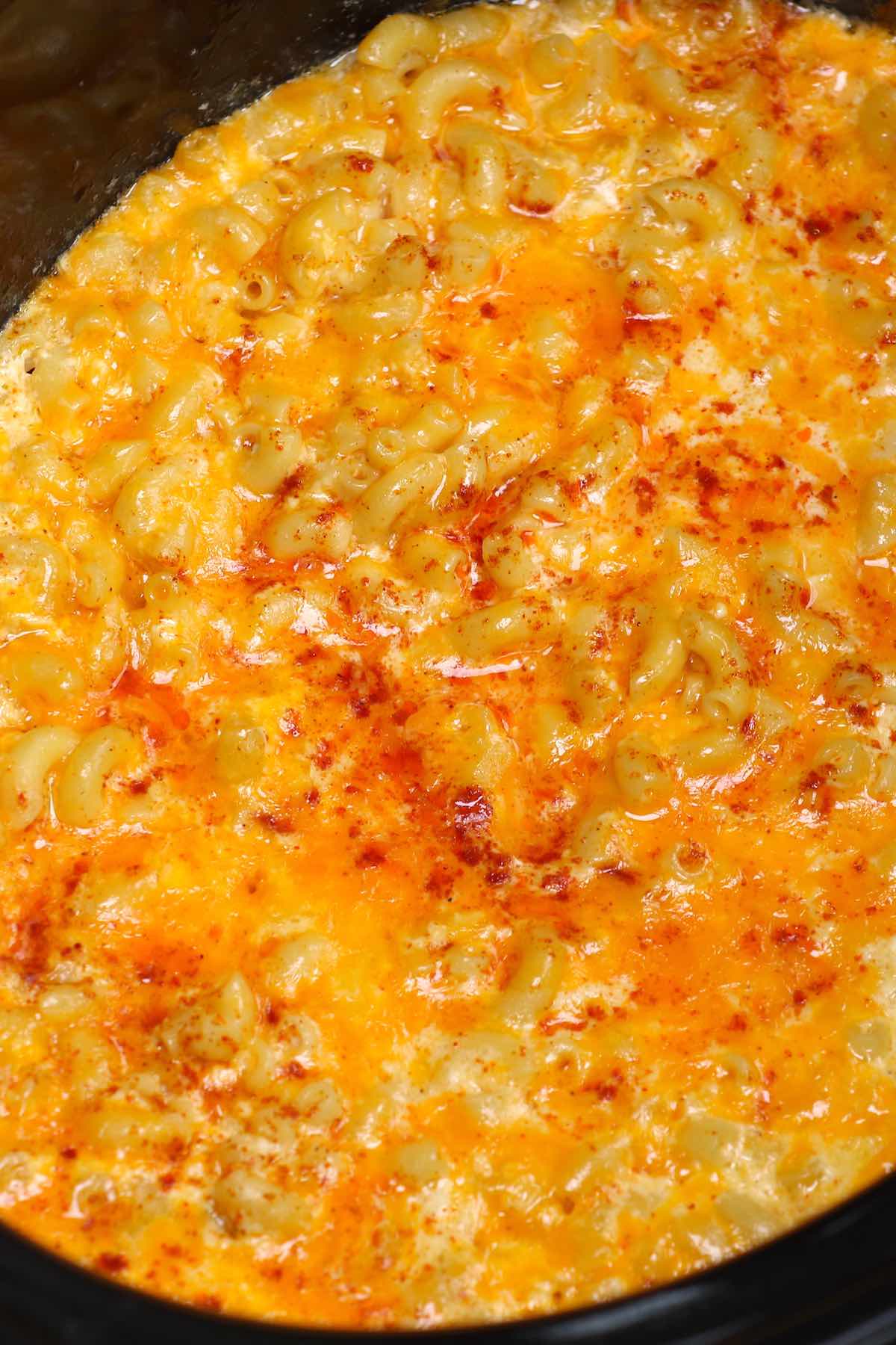 Close up of mac and cheese bubbling away in a crockpot